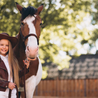 cute-little-blonde-girl-with-horse-ranch